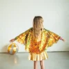 La capa holográfica con flecos – Oro